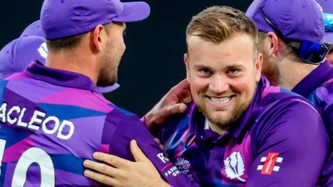 Mark Watt celebrates a wicket for Scotland