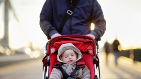 Dad with child in pram