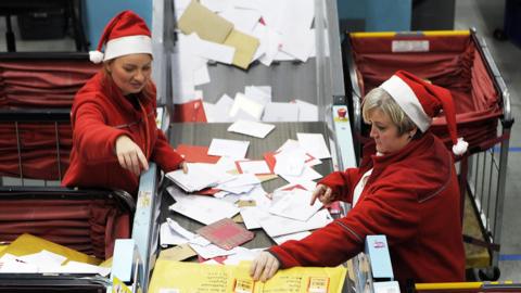 Royal Mail workers at a sorting office in the run up to Christmas
