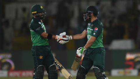 Pakistan's Iftikhar Ahmed and Agha Salman shake hands during the final ODI against New Zealand