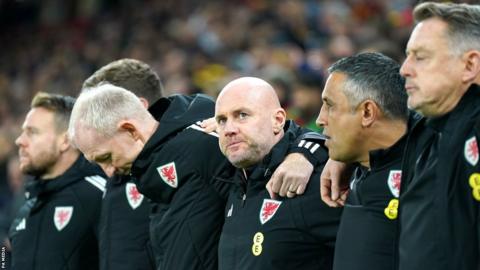 Wales manager Rob Page looks on alongside his backroom staff