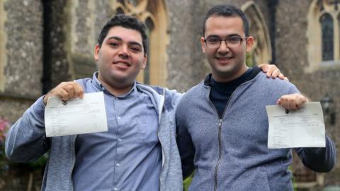 Syrian refugees Sulaiman Wihba (left) and Elias Badin after collecting their A-level results at Brighton College