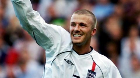 David Beckham celebrates.