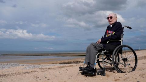 Veteran on wheelchair on beach