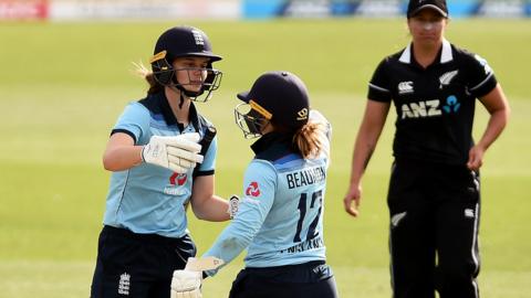England batters Amy Jones (left) and Tammy Beaumont (right) celebrate beating New Zealand in the second ODI
