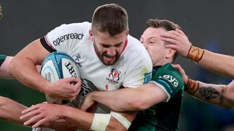 Stuart McCloskey is tackled by Jack Carty