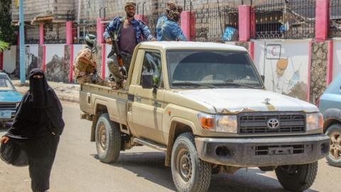 Fighters from the separatist Southern Transitional Council (STC) patrol the streets of Aden, Yemen, on 26 April 2020