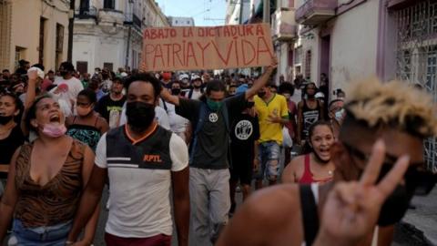 People shout slogans against the government during a protest against and in support of the government, amidst the coronavirus disease (COVID-19) outbreak, in Havana, Cuba July 11, 2021
