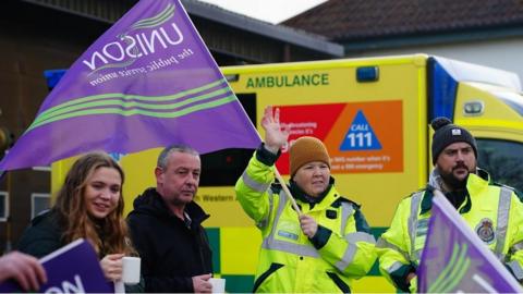 Ambulance workers on the picket line outside an ambulance station in Bristol