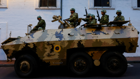 Tanks patrol the streets of Quito