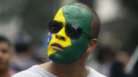 A supporter of Brazilian right-wing presidential candidate Jair Bolsonaro takes part in a rally along Paulista Avenue