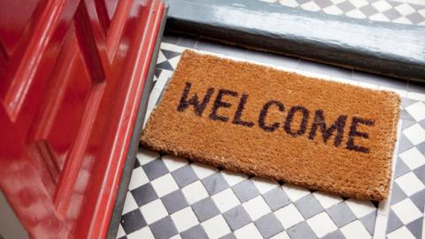 Welcome mat and front door