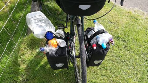 Bike panniers filled with litter