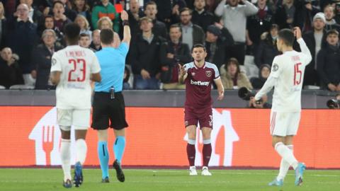 West Ham's Aaron Cresswell (centre) is sent off against Lyon