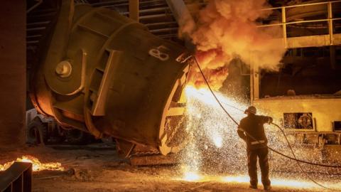 A worker in a steel factory