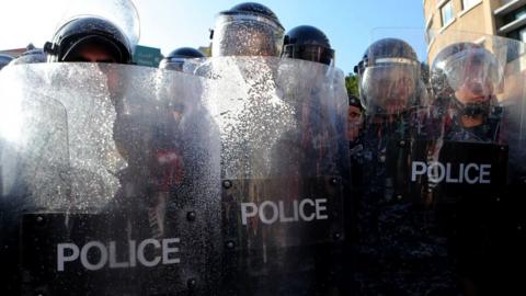 Lebanese riot police hold a position as they clash with demonstrators during a protest against the government's decision to raise taxes to cover a salary increase for teachers and other public servants, in downtown Beirut, on 19 March 2017