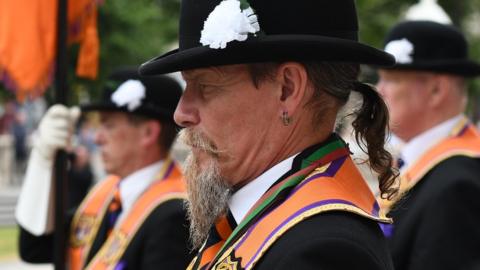 An Orangeman wearing a bowler hat at the Twelfth parade in Belfast