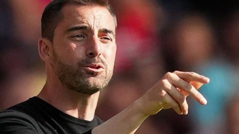 Reading boss Ruben Selles calls instructions to his players on the pitch from the touchline.