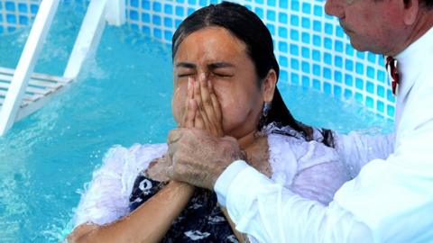 Followers of the Mexican-based Pentecostal church Light of the World, participate in a baptism ceremony in Guadalajara