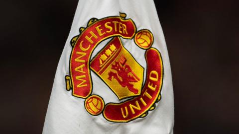 Manchester United crest on a flag