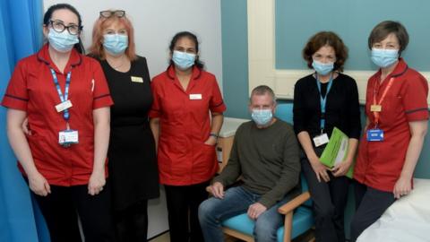 Some of Northampton General Hospital’s research team with the first patient John, from Northampton