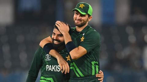 Shaheen Afridi (right) embraces Fakhar Zaman as they celebrate a wicket for Pakistan