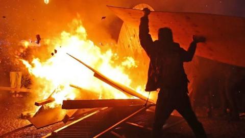 Protesters set fire to construction equipment in Paris
