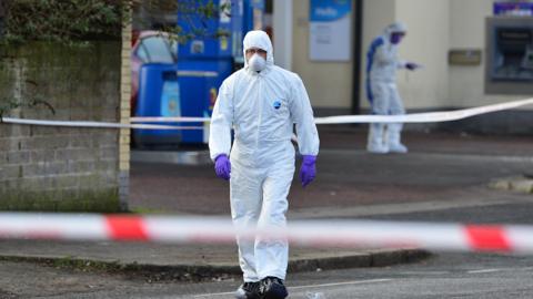 Forensic officers at the scene of the Crumlin Road shooting