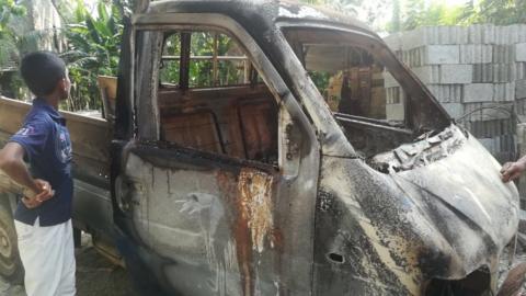 The shell of a truck that appears to have been set alight during street clashes between Buddhists and Muslims in Galle province, Sri Lanka