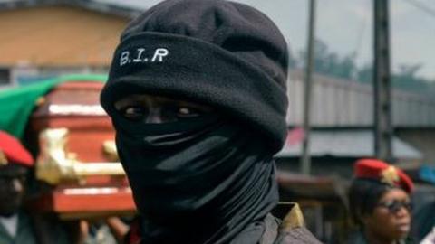 A soldier from the Rapid Intervention Battalion (BIR), provides security at a ceremony honouring four soldiers killed in after violence that erupted in the Northwest and Southwest Regions of Cameroon, where most of the country's English-speaking minority live, in Bamenda on November 17, 2017.