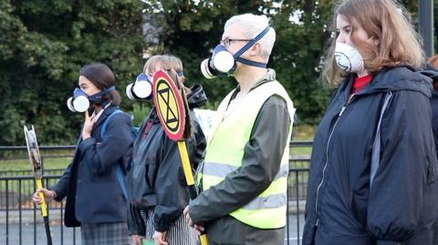 Residents and schoolchildren were part of the action at a busy Newcastle junction during rush hour.