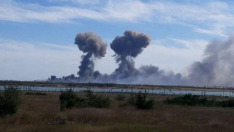 Image shows twin mushroom clouds