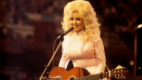 Dolly Parton performing.