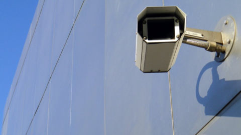 A CCTV camera on the side of a building 