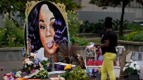A woman visits the memorial for Breonna Taylor in Louisville