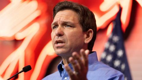 Florida governor Ron DeSantis speaks in Iowa.