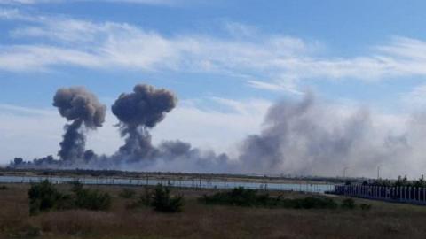 Smoke rises after explosions were heard from the direction of a Russian military airbase near Novofedorivka, Crimea, in this still image obtained by Reuters August 9, 2022