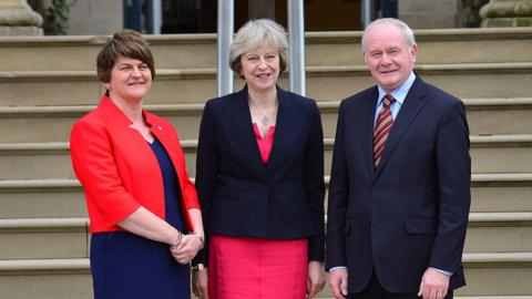 Theresa May is welcomed at Stormont Castle by Northern Ireland's first and deputy first ministers