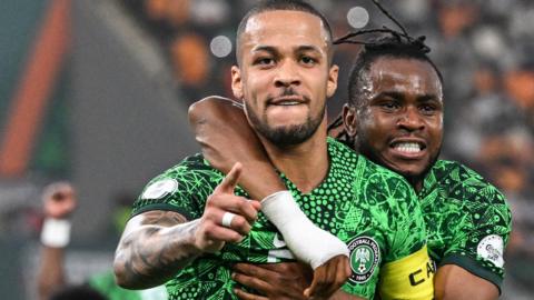 William Troost-Ekong (left) celebrates scoring a penalty for Nigeria against South Africa at the 2023 Africa Cup of Nations