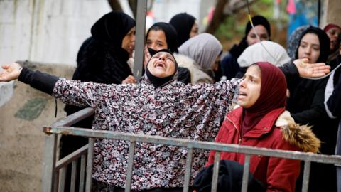 Relatives of Nader Rayan, 16, mourn after he was shot dead during clashes with Israeli forces at the Balata refugee camp in Nablus, in the occupied West Bank (15 March 2022)