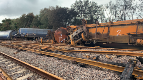 The burnt out wreckage of the train crash