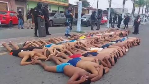 Suspects were made to lie down in the street in their underwear