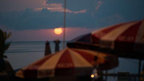 The sun sets over Patong beach in Thailand's Phuket province