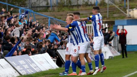 Hartlepool players celebrate goal with fans