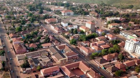 Picture taken on March 9, 2019 shows an aerial view of the presidential palace (top R), and the Estadio Lino Correia (L) in Bissau, capital city of Guinea-Bissau, the day before the country's parliament election