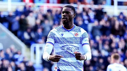 Reading's Kelvin Ehibhatiomhan celebrates after Wigan Athletic's Will Aimson scores an own goal