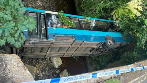 The aftermath of the crash on August 3 at Grosmont Bridge, where a bus plunged into the river.