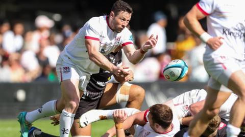 Ulster's John Cooney passes the ball against Sharks