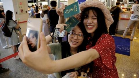 People take part in a flight to nowhere in Taiwan