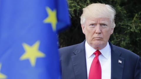 US President Donald Trump arrives to pose for a family photo with participants of the G7 summit in Taormina, Sicily, 27 May 2017